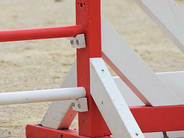 View of jump cups on dog agility bar jump.