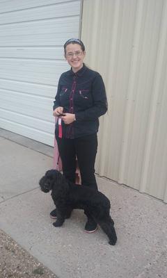 Me and my dog after our first competition (I was shy so I'm not showing off my ribbons :P)